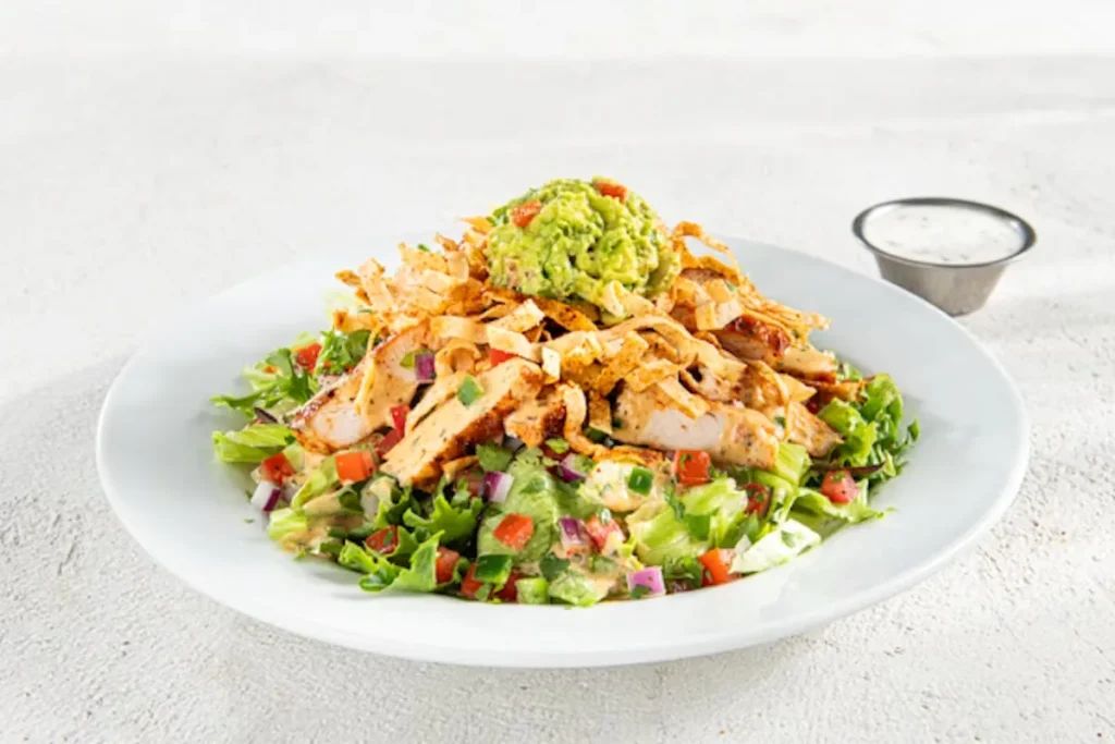 Santa Fe Salad Ingredients:Grilled Chicken, Black Beans, Sweet Corn, Shredded Cheese, Crispy Tortilla. Price: $14.99 Calories: 450-750 Cal